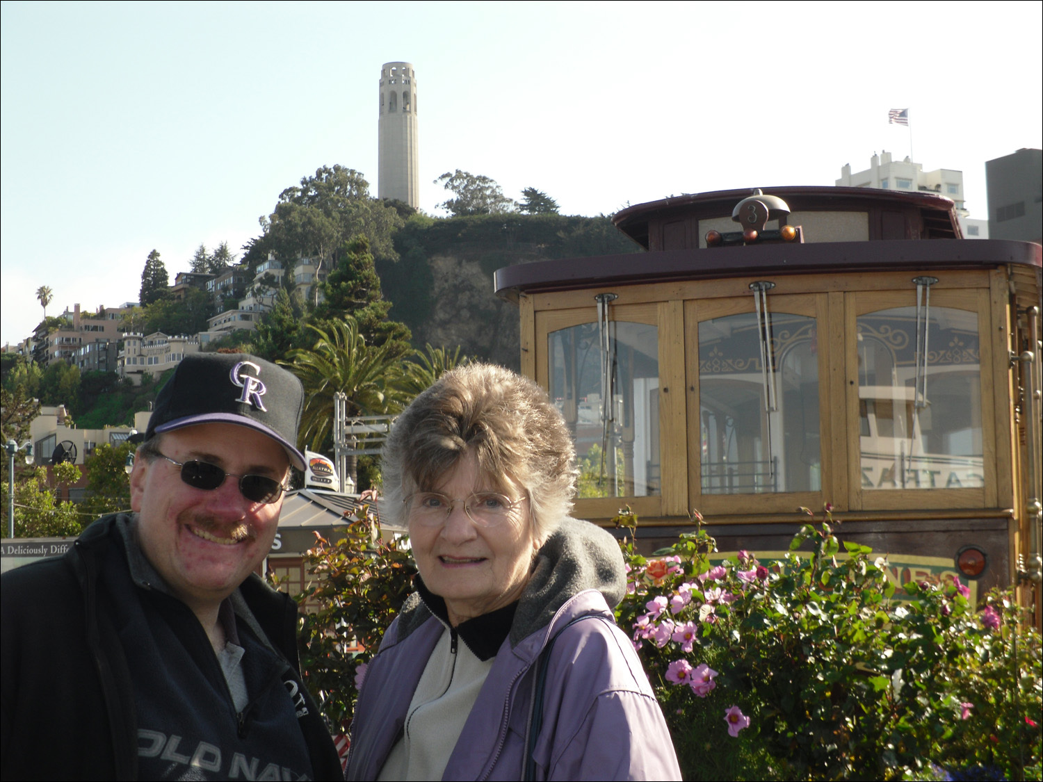 David Burrall and Anne McCarthy with Coit Tower and cablecar